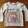 White T-shirt decorated at home with a colourful drawing and relief work showing a large F, made using ökoNORM Wax Fabric Crayons | © Conscious Craft